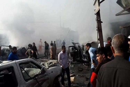 العراق:قتلى وجرحى بانفجار سيارة مفخخة داخل سوق شعبي في الموصل(صور)